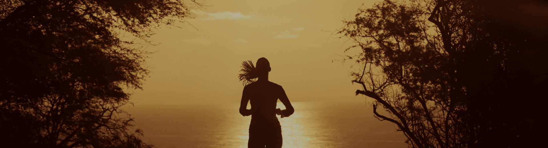 Woman running at sunset